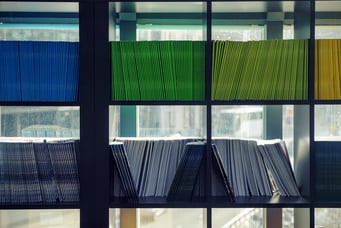 Folders on a bookcase